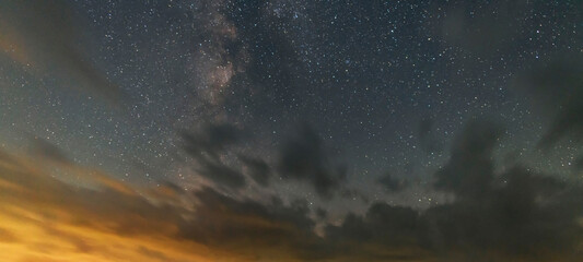 Beautiful night sky. Milky way galaxy with clouds in the starry night.