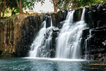 Scenic cascade waterfall with amazing rocks in Mauritius