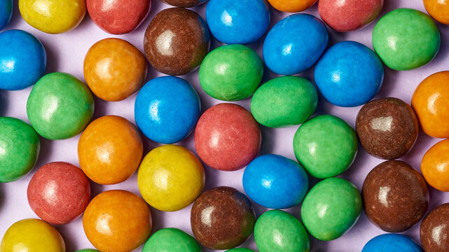 New MMs on a beige background. Background from a mms balloon. lots of sweets.