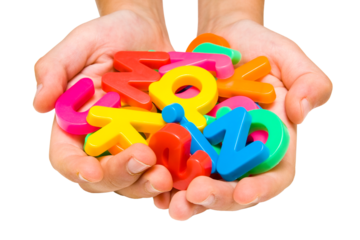 Child hands with color alphabet