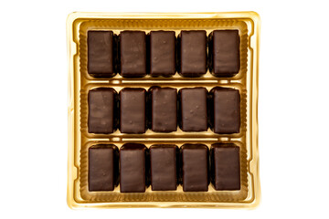 Dark chocolate pralines in a golden square box