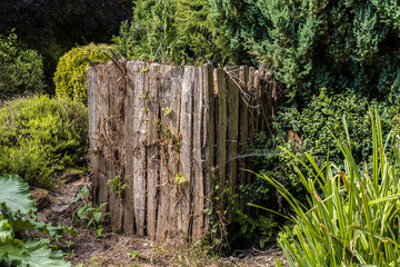Old compost bin made out of wood.