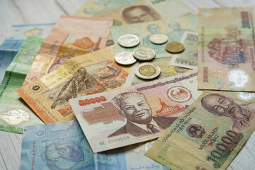 Asian banknotes from different countries - thai baht, vietnamese dong, malaysian ringgit, lao kip