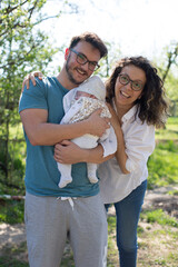 parents and child in park