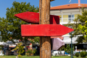Wooden arrow sign post. Empty boards for your text