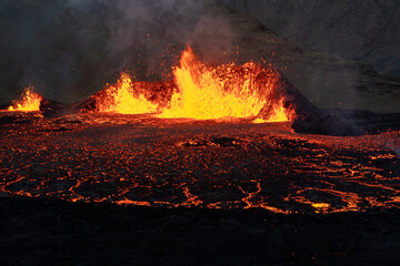 Volcano eruption at Meradalir near Fagradalsfjall, Iceland. Erupting magma and flowing lava at...