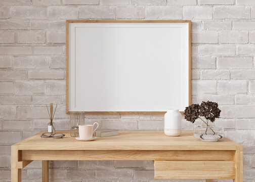 Empty horizontal picture frame on white brick wall in modern living room. Mock up interior in minimalist, contemporary style. Free space for your picture, poster. Wooden table, vase. 3D rendering.