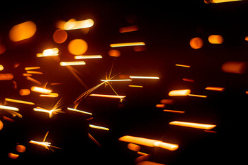 abstract image of sparks from a circular saw, photographed in close-up macro mode. Front and back...