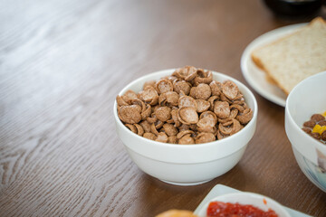 Cornflakes Breakfast on wooden table.