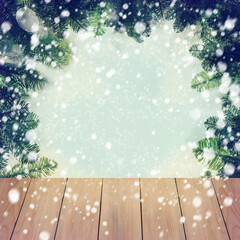 New Year's background. Spruce branches on a wooden table. Christmas concept.