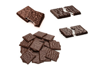 Dark chocolate candies isolated on white background.