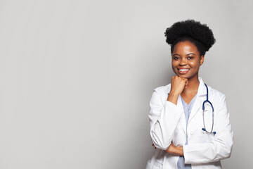 Portrait of black woman doctor with stethoscope on white background