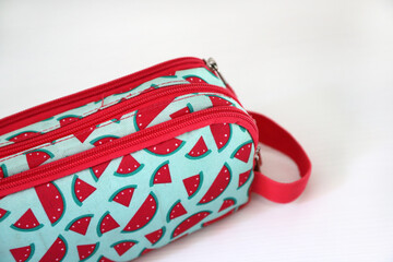 Detail of  School supplies pencil case with watermelon design. Fabric bag with closure. Pencil bag....
