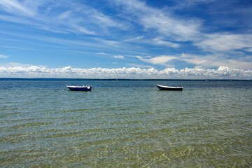 empty fishing boats in the water of Bay of Puck in Kuznica,  Hel Peninsula. Poland