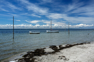 fishing boat and empty sandy beach in Kuznica, Hel Peninsula, Poland