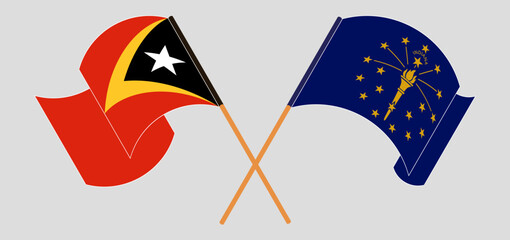 Crossed and waving flags of East Timor and the State of Indiana