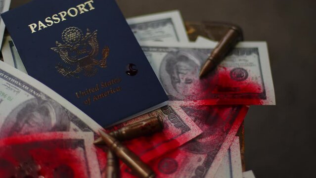 Blood money. The concept of illegal circulation of dollars. Dollar bills and American passport stained with blood