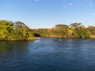 beautiful river with many rocks and green vegetation