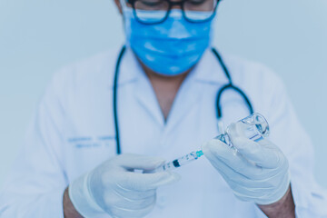 Concept of chemical, scientific experiment, monkeypox virus. Closeup, copy space on right. Chemistry experiments in science labs. Drop chemical matter into test tube place on desk. Blurred background