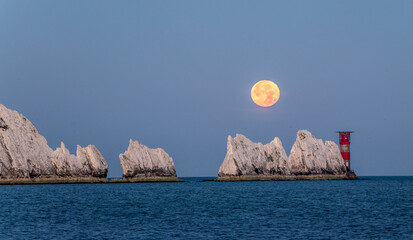 Setting full sturgeon moon setting over the Needles Rocks