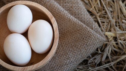 Close Up shot Duck organic eggs in the wood cup. Food for healthy life form nature farm Sell within the market.