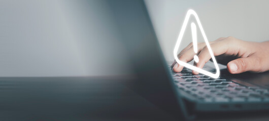 Triangle caution warning sing on laptop screen and Businessman using. Problem for notification error 404 and maintenance service alarm or beware hazard in internet network concept.