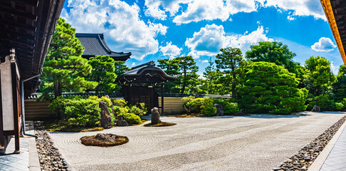 Panoramic view of stone garden in Kenninji temple under dynamic blue sky at KYOTO, JAPAN. This...