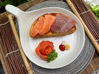 Salmon and tuna waffle with smoked salmon