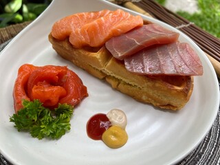 Salmon and tuna waffle with smoked salmon