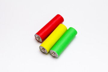 A group of red green yellow Lithium ion industrial high current batteries in white background