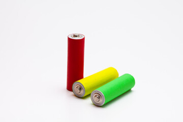 A group of red green yellow Lithium ion industrial high current batteries in white background