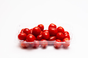 Red ripe cherry tomatoes with water drops