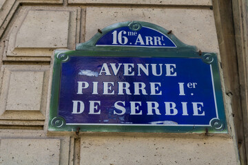 Street sign with the inscription avenue Pierre I de Serbie in Paris