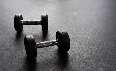 Obraz na płótnie Canvas dumbbell on black background, Dumbbells on dark background, fitness equipment