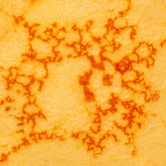 Pancake with caramel syrup as a textured background.  Pancakes Pattern.
