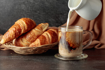 Croissants and coffee with cream.