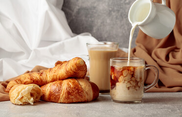 Croissants and coffee with cream.