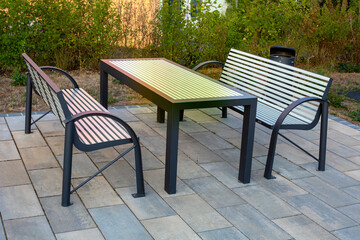 set of a table and two modern style benches outdoors