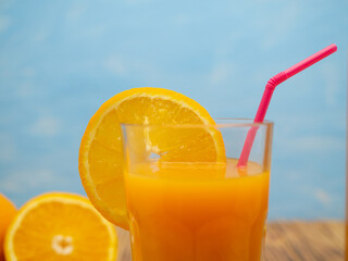 Fresh juice, mix fruits, orange drink on a blue background