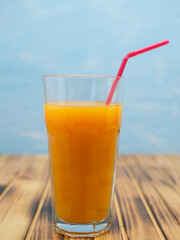 Fresh juice, mix fruits, orange drink on a blue background