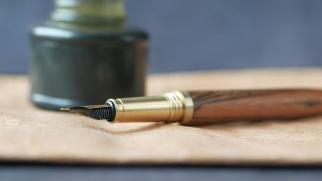 envelope , empty paper and fountain pen on table 