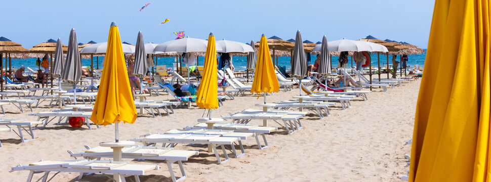 Traditional beach chair and umbrella. Rimini, Italy, 