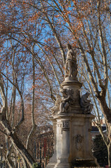 park in autum with hero statue in madrid spain europe