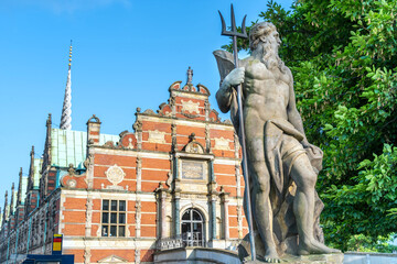 Neptune statue at the entrance of Borsen, building of the Chamber of Commerce, in Copenhagen, Denmark