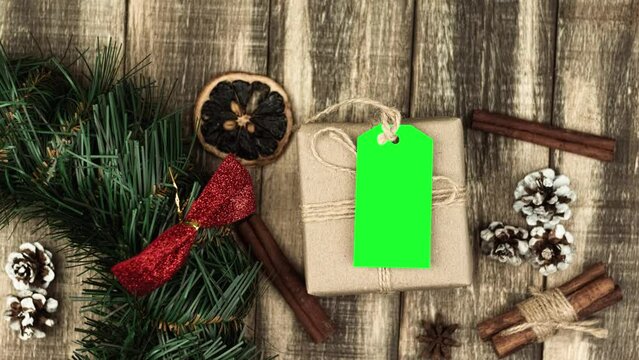 Box with twine and tag, background with copy space. Chroma key. Christmas card. View from above. Copy space - image. Camera zoom