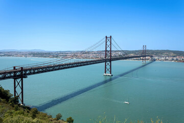 An aerial view of the 25 de Abril Bridge (Portuguese: Ponte 25 de Abril) across the Tagus river