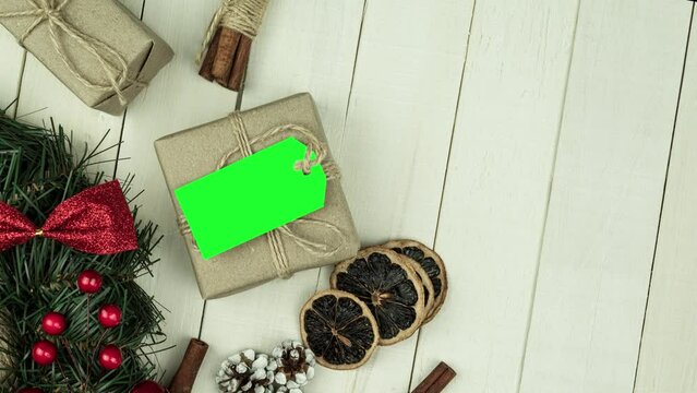 Box with twine and tag, background with copy space. Chroma key. Christmas card. View from above. Copy space - image. Camera zoom