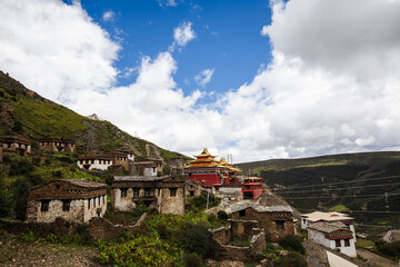 Tibetan monastery on a hill with monk quarters and main hall in Sichuan province
