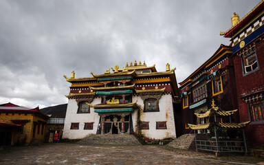 Tibetan monastery building with cloudy sky above