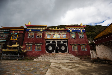 Traditional Tibetan monastery under cloudy sky